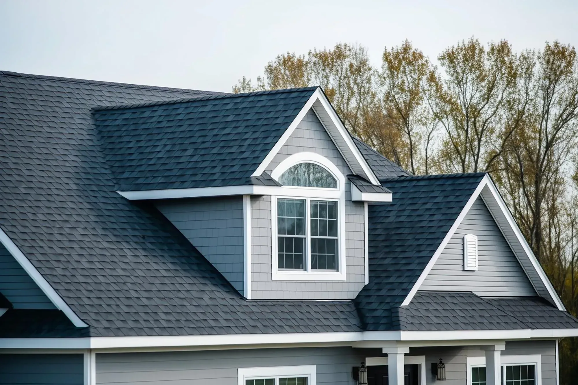 Large home with a newly installed asphalt shingle roof
